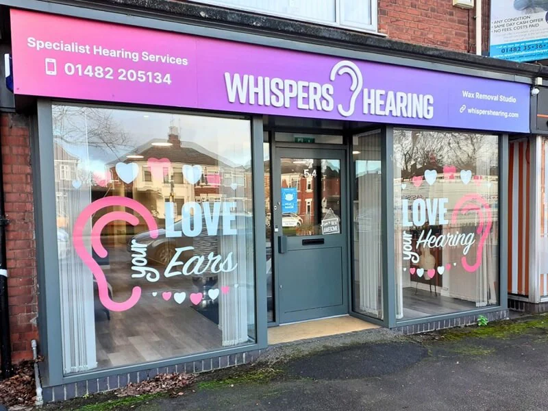 Outdoor shop front sign and window graphics for Whispers Hearing, Hull.